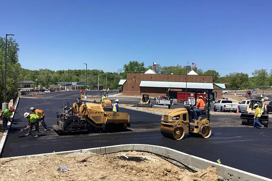 asphalt overlay being applied to a commercial parking lot in collinsville il